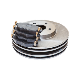 A close up of a brake disc and pads on a white background